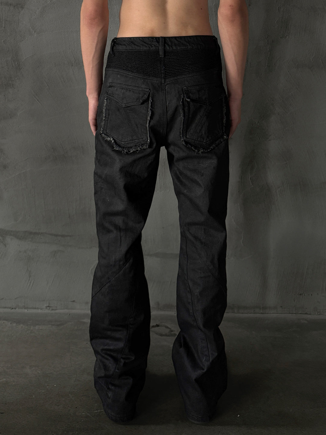 SERONINE CTX-54 Wax-Coated Frayed-Edge Zip Denim Pants - back full-length studio fit