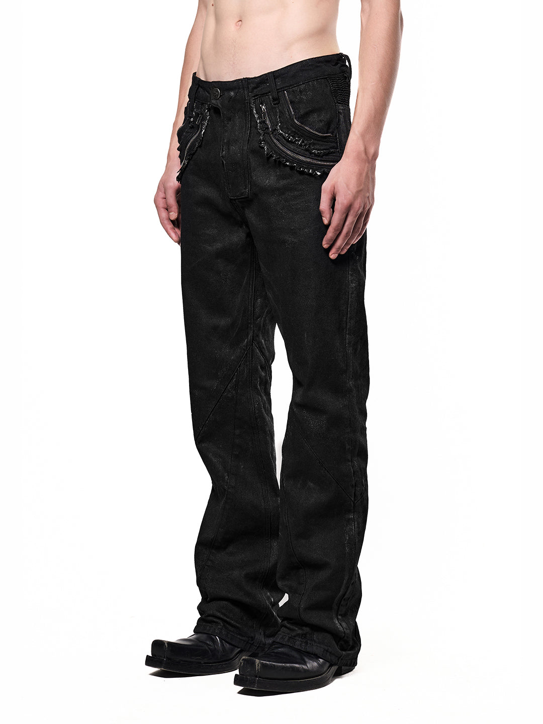 SERONINE CTX-54 Wax-Coated Frayed-Edge Zip Denim Pants - angled front fit on model