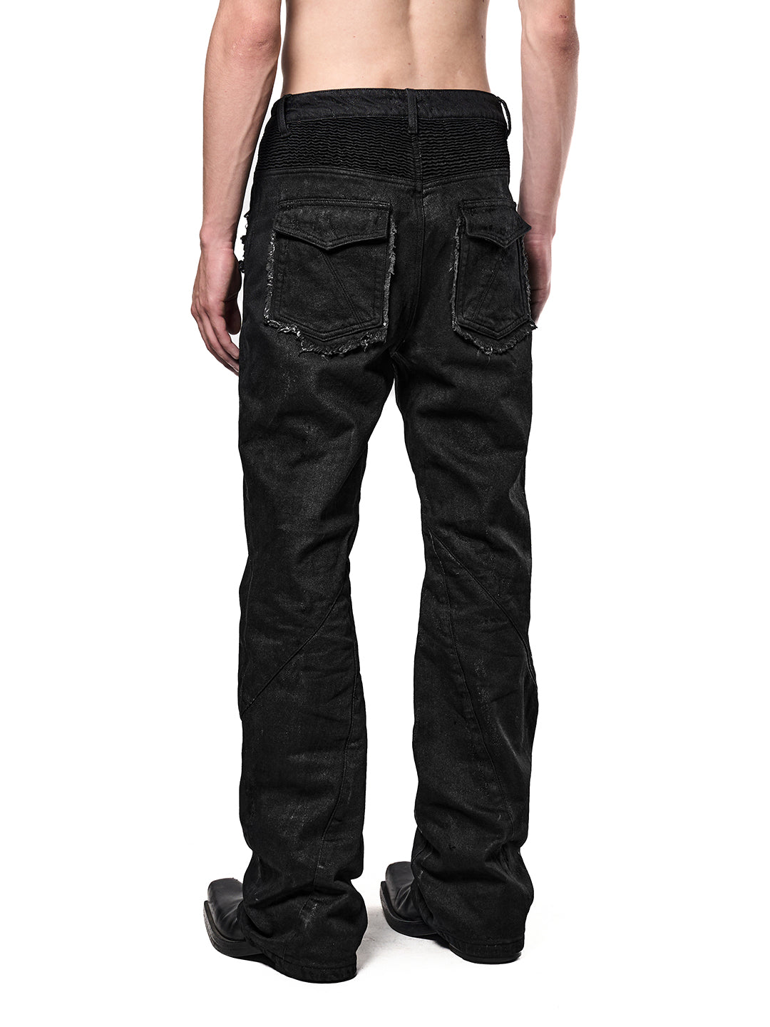 SERONINE CTX-54 Wax-Coated Frayed-Edge Zip Denim Pants - angled back fit on model