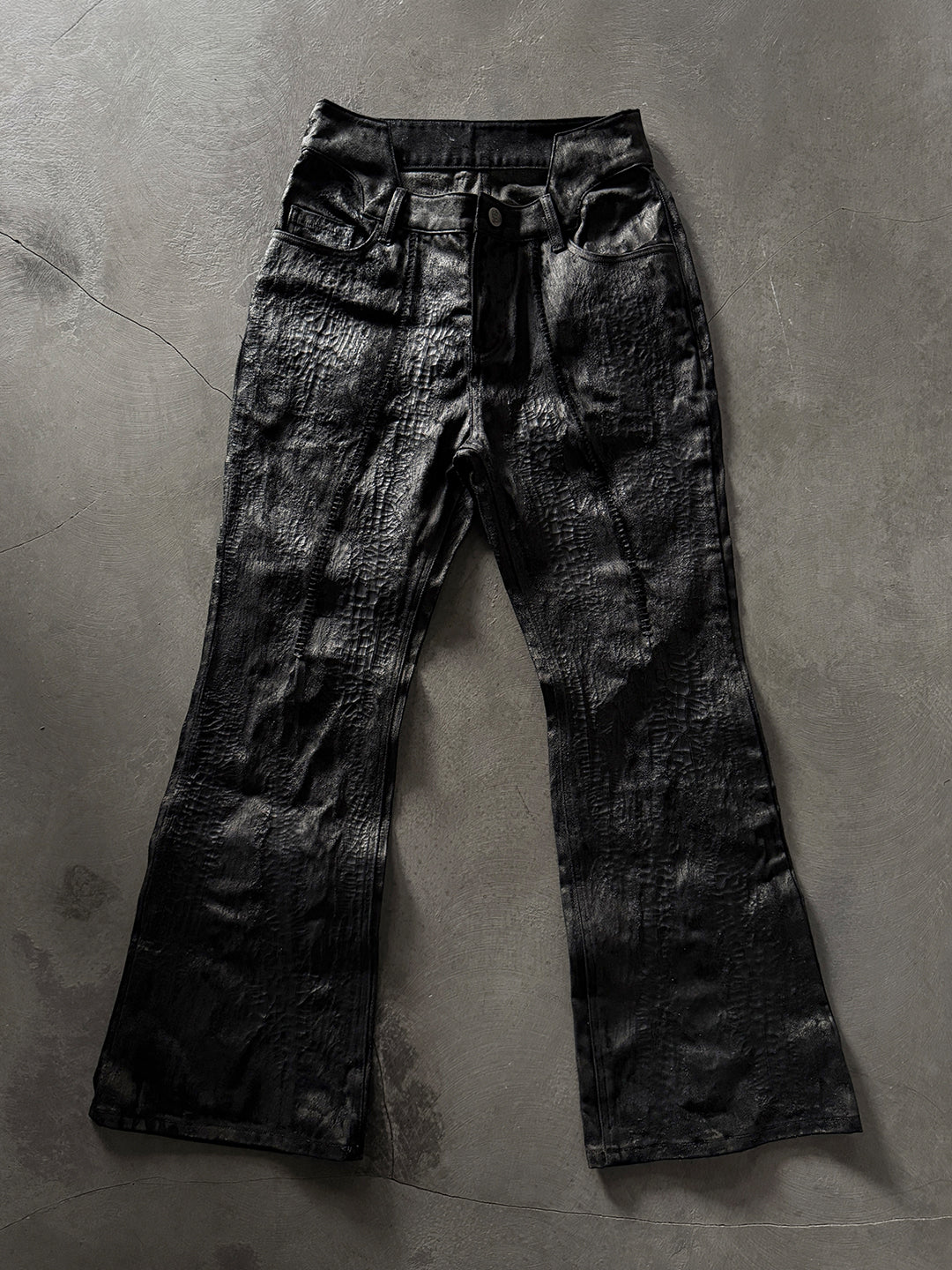 SERONINE CTX-55 wax-coated structural black jeans with scar-like stitching